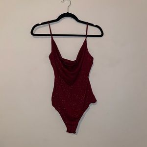 Sparkly burgundy body suit